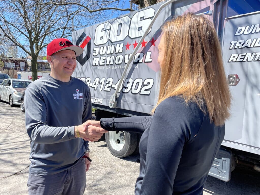 Junk Removal Expert Handshaking with Client